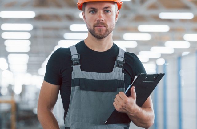 industrial-worker-indoors-in-factory-young-technic-FMS423C.jpg